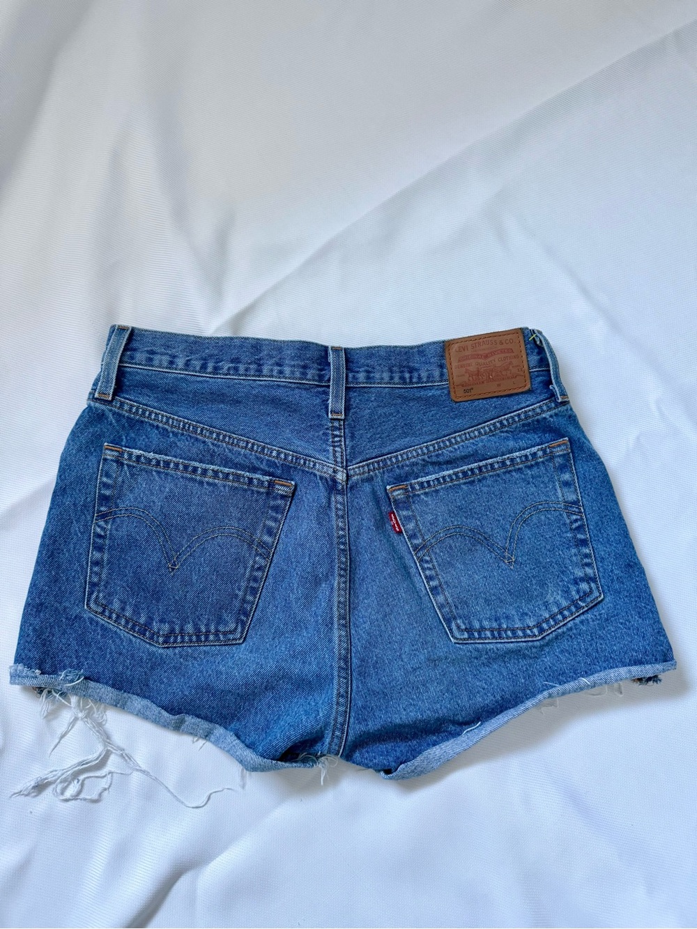 LEVI’S 501 Denim High Rise Jean Shorts in Denim Blue Distressed